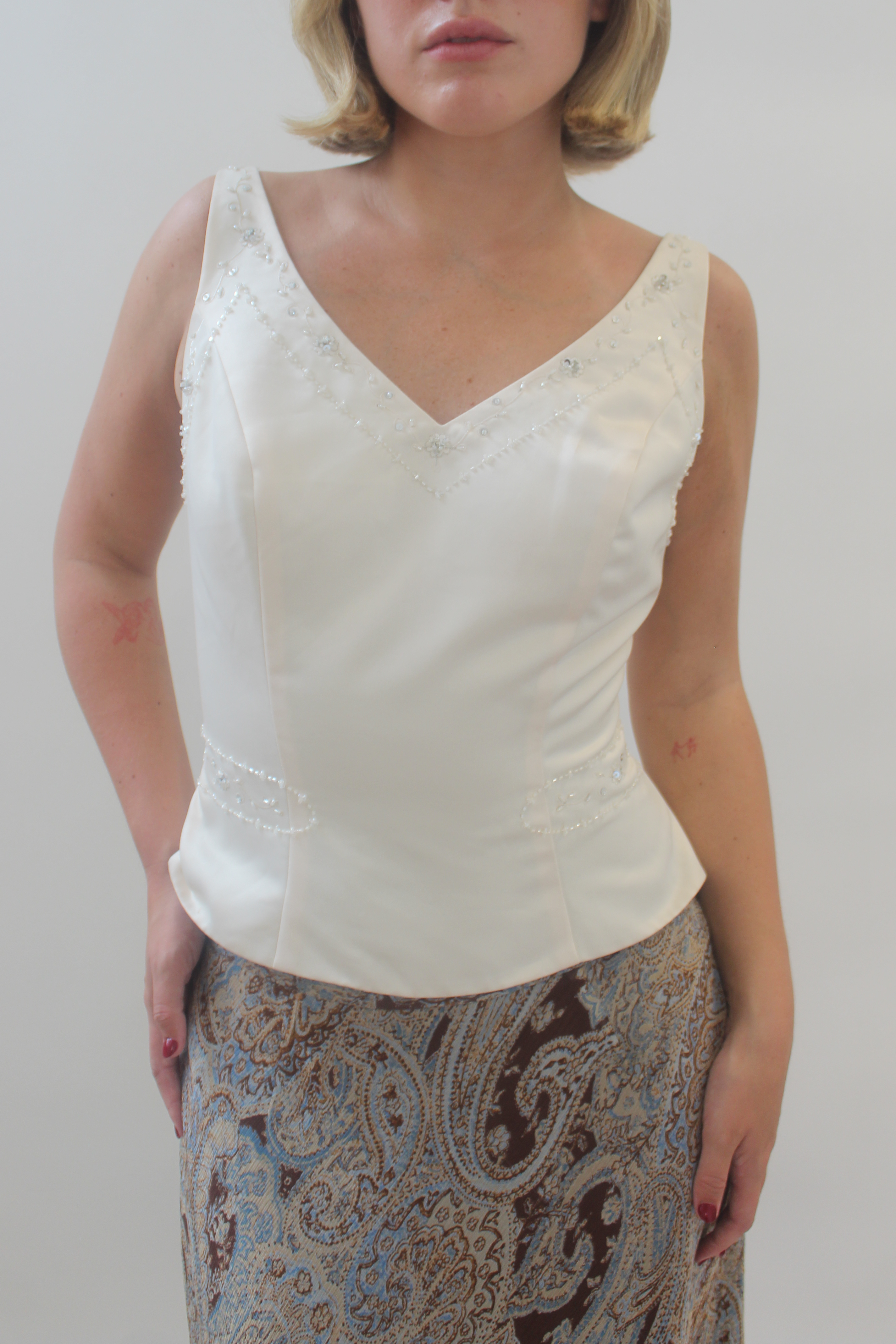 Cream top with beaded details